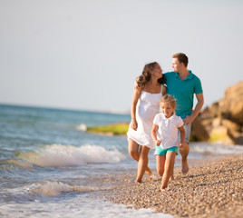 pregnant woman and her family near the sea