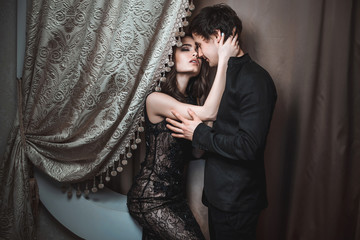 Young beautiful pair of lovers hug and kiss