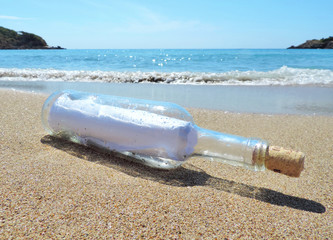 Message in a bottle, washed ashore the beach 