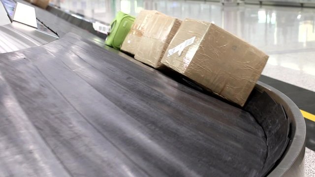 package on the conveyor in the airport