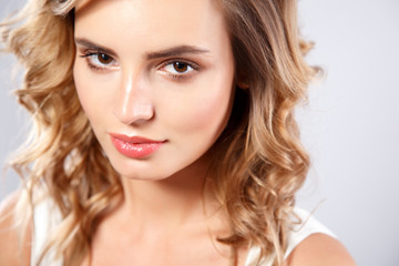 Fototapeta premium Close-up portrait of beautiful young woman with gorgeous hair and natural makeup. Fashion beauty photo