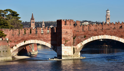 Scaliger Bridge in Verona with Tower of Lamberti, the city tallest tower, and belfries of St Anastasia and Eufemia