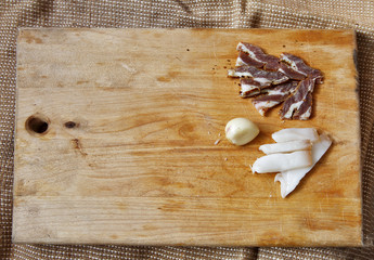 Salt meat and ingredients for cooking around cutting board