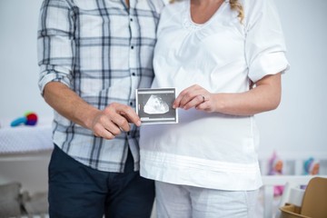 Pregnant couple at home