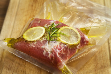 Spiced steak in vacuumed package.