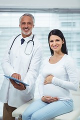 Pregnant woman interacting with doctor