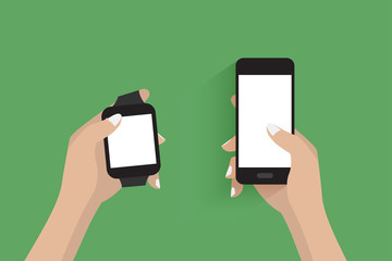 Modern smartwatch and hand using a smartphone.