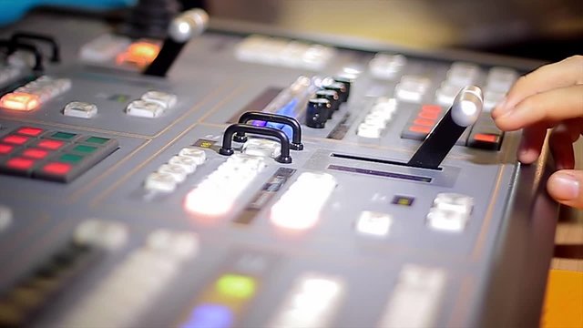 Director's hand move tv broadcasting mixer