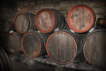 lying barrels of wine in a cellar