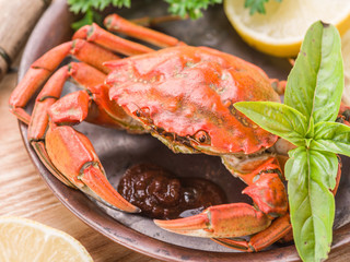 Cooked crab with lemon and herbs.