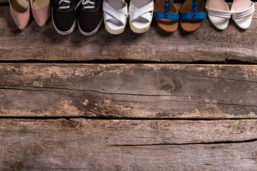 Female footwear on wooden floor. 