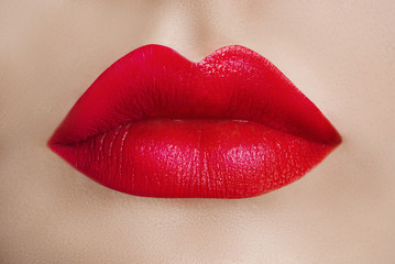 Female lips close up. Red lipstick. Sensuality. Perfect Beauty