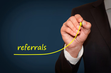 Businessman draw growing line symbolize growing referrals
