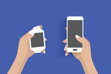 Modern smartwatch and hand using a smartphone. Blue background.