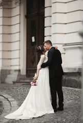 Luxury married wedding couple, bride and groom posing in old city