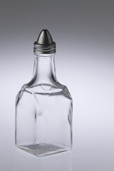 empty glass oil container