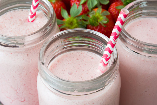 Strawberry smoothie on wooden 
