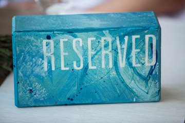 Reserve a restaurant sign, brick, stone, shape, blue, white