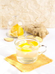 ginger tea with lemon in a glass cup