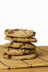 Fototapeta na wymiar Stack of Chocolate chip cookies on wooden with white background.