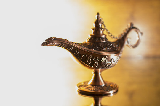 Aladdin's lamp on bright background