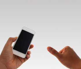 a man using hand holding the smartphone and thumb up