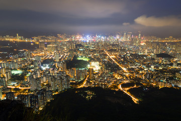 View of Kowloon in Hong Kong from above from the Lion Rock in Hong Kong, China, at night.