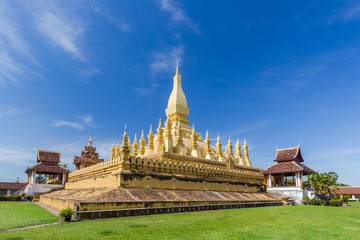 Golden pagada in Pha-That Luang tample on blue sky background,  Vientiane, Laos.
