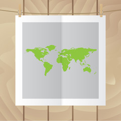 Flat vector icon. Color photo hanging on a rope. World map.