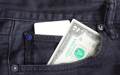 Blank business card and two dollar  in a pocket of gry worn out jeans.