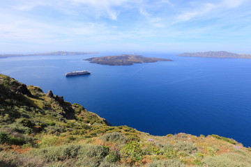 Cruise ship near volcano on island of Santorini, Greece