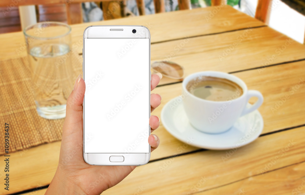 Aufkleber smart phone with isolated display for mockup in hand. relax time with coffee on table.