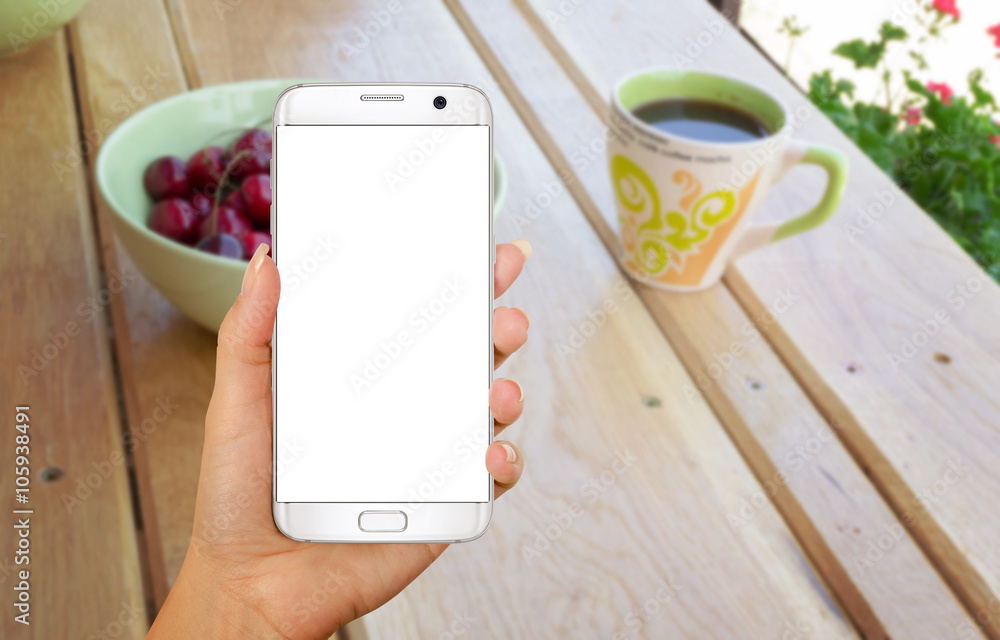 Aufkleber smart phone with isolated display for mockup in hand. relax time with coffee on table.