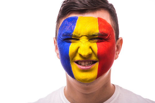 Victory, happy and  goal scream emotions of Romanian football fan in game support of  Romania national team on grey background. European 2016 football fans concept.