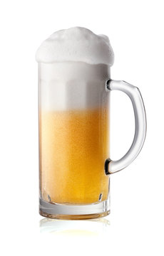 Narrow glass of beer with foam