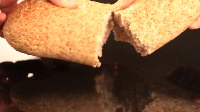 The rite of breaking bread in the New Testament. To share friendly meal
