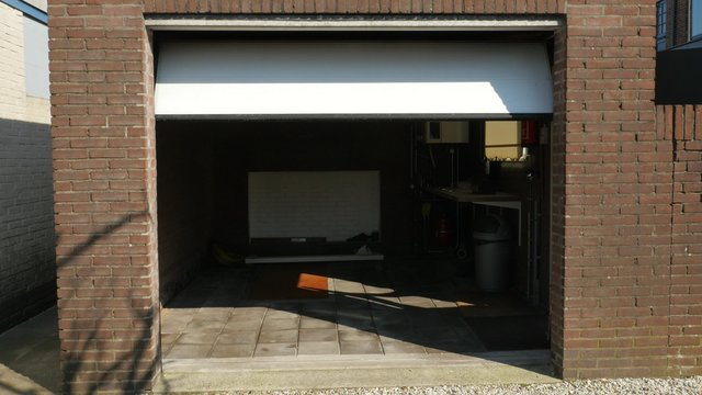 Garage door of a detached house closing
