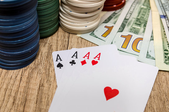 four aces  with chips and us dollar