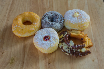 Donuts on wooden background