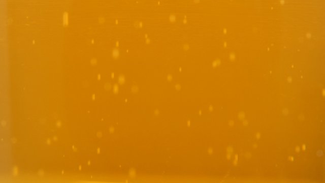 Fresh tasty beer bubbles and foam in glass 4K 3840X2160 UltraHD footage - Glass of beer and bubbles flowing 4K 2160p UHD video 