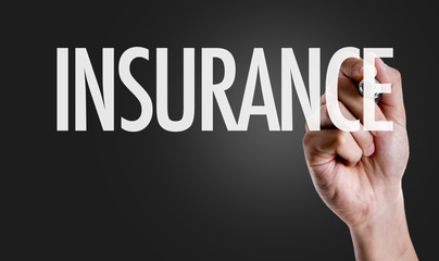 Hand writing the text: Insurance