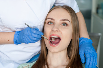 Dentist examining a patient's teeth