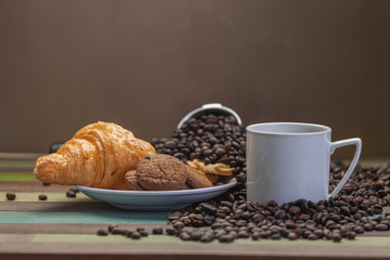 Close up cookies with white coffee cup and beans