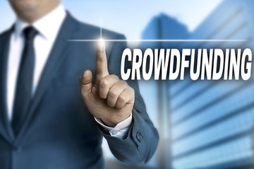 crowdfunding touchscreen is operated by businessman background