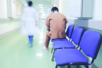 Lonely patient in hospital corridor - obrazy, fototapety, plakaty