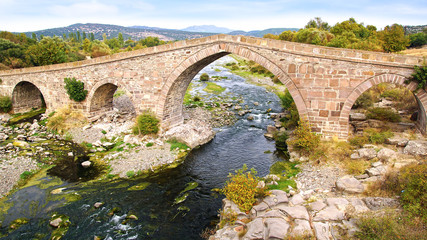 Fototapeta na wymiar The ancient Ottoman Bridge of Assos.