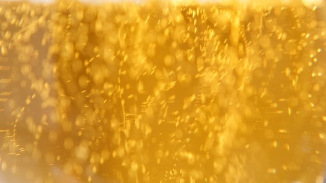 Glass full of beer slow moving bubbles 4K 3840X2160 UltraHD footage - Bubbles and foam moving fast in glass of beer 4K 2160p UHD video 