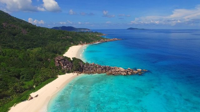 Aerial view of tropical paradise of Grand Anse in La Digue Island, Seychelles.