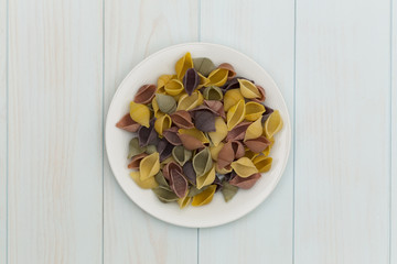 Raw cocciolette pasta in a white plate