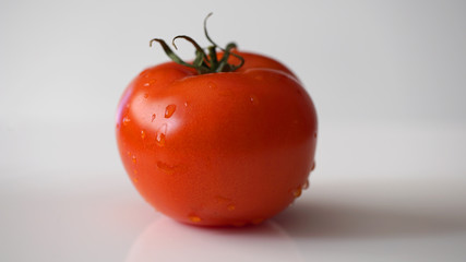 Fresh tomato  isolated on white
